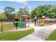View of the community park featuring a gazebo, playground, and well-maintained green spaces at 5123 Lighthouse Rd, Orlando, FL 32808