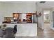 Kitchen with breakfast bar overlooking a large dining area and stainless steel appliances at 5123 Lighthouse Rd, Orlando, FL 32808