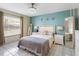 Comfortable primary bedroom with a large bed, side tables, and natural light from the window at 5123 Lighthouse Rd, Orlando, FL 32808