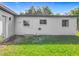 Sunny backyard with ample space and the rear of the home at 514 S Cottage Hill Rd, Orlando, FL 32805