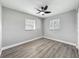 Light-filled bedroom with wood-look floors, ceiling fan and neutral color palette at 514 S Cottage Hill Rd, Orlando, FL 32805