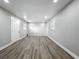 Spacious bedroom with gray walls, new flooring and abundant natural light at 514 S Cottage Hill Rd, Orlando, FL 32805