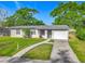 Charming home featuring a well-maintained front yard and driveway at 514 S Cottage Hill Rd, Orlando, FL 32805