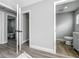 Hallway featuring access to a bathroom and closet at 514 S Cottage Hill Rd, Orlando, FL 32805