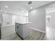 The kitchen with gray island has stainless appliances and bright, neutral paint at 514 S Cottage Hill Rd, Orlando, FL 32805