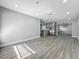 Bright, open-concept living area with modern flooring, recessed lighting, and seamless flow into the kitchen at 514 S Cottage Hill Rd, Orlando, FL 32805