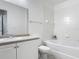 A bright bathroom includes a tub and shower combination, with vanity and sink at 5550 E Michigan St # 2214, Orlando, FL 32822