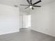 Spacious bedroom features a ceiling fan and light colored hardwood floors, offering comfort and style at 5550 E Michigan St # 2214, Orlando, FL 32822