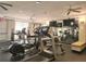 Well-equipped gym featuring treadmills, elliptical machines, and mirrored walls for a full workout experience at 5550 E Michigan St # 2214, Orlando, FL 32822