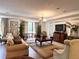 This inviting living room has a neutral color palette and lots of natural light at 5550 E Michigan St # 2214, Orlando, FL 32822