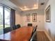 Conference room featuring a large wooden table, leather chairs, and ample natural light for productive meetings at 5550 E Michigan St # 2214, Orlando, FL 32822