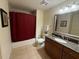 Well-lit bathroom with a granite vanity, framed mirror, and a shower and tub combination at 7658 Whisper Way # 203, Reunion, FL 34747