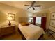 Cozy bedroom featuring a comfortable bed, bedside tables, and tasteful decor at 7658 Whisper Way # 203, Reunion, FL 34747