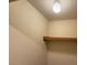 Walk-in closet includes a shelf with a hanging rod ready for storage at 7658 Whisper Way # 203, Reunion, FL 34747
