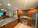 Modern kitchen features stainless steel appliances, granite countertops, and lots of cabinet space at 7658 Whisper Way # 203, Reunion, FL 34747