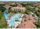 Aerial view of resort-style pool, water slides, and the surrounding community at 7719 Comrow St, Kissimmee, FL 34747