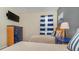 Well-decorated bedroom with nautical decor, featuring two twin beds, a TV, and blue accents at 7719 Comrow St, Kissimmee, FL 34747