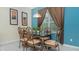 Cozy dining area featuring decorative chairs, stylish table, and ample natural light at 7719 Comrow St, Kissimmee, FL 34747