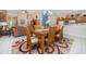 Open dining area with stylish chairs and table that connects to the living room and kitchen at 7719 Comrow St, Kissimmee, FL 34747