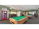 A community game room featuring a pool table, arcade games, and tables at 7719 Comrow St, Kissimmee, FL 34747