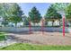 Community playground featuring swings with mature landscaping at 7719 Comrow St, Kissimmee, FL 34747