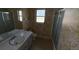 Full bathroom with floral wallpaper, framed mirror, vanity, sink, tub, and shower at 8 Emerald Way, Ocala, FL 34472