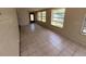 Spacious, tiled living room with multiple windows for plenty of sunlight at 8 Emerald Way, Ocala, FL 34472
