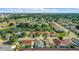 An aerial view of a residential neighborhood featuring a central pond with a fountain at 832 Whalebone Bay Dr, Kissimmee, FL 34741
