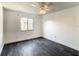 Well-lit bedroom featuring modern flooring, neutral walls, and a window providing natural light at 832 Whalebone Bay Dr, Kissimmee, FL 34741