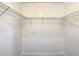 Empty walk-in closet with white walls and wire shelving providing ample storage space at 832 Whalebone Bay Dr, Kissimmee, FL 34741