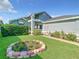 Well-maintained single Gathering home with lush green grass and walkway to the front door at 832 Whalebone Bay Dr, Kissimmee, FL 34741