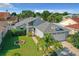 Charming home featuring a two-car garage, landscaped lawn, and lovely curb appeal at 832 Whalebone Bay Dr, Kissimmee, FL 34741