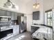 Modern kitchen with stainless steel appliances, gray cabinets, and tile backsplash at 832 Whalebone Bay Dr, Kissimmee, FL 34741