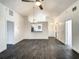 Open living area boasts vaulted ceilings, stylish flooring, and a view into the kitchen at 832 Whalebone Bay Dr, Kissimmee, FL 34741
