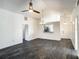 Bright, open living room featuring vaulted ceilings, dark wood floors, and a view into the kitchen at 832 Whalebone Bay Dr, Kissimmee, FL 34741
