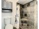 Updated bathroom shower with decorative tile and a built-in corner seat at 832 Whalebone Bay Dr, Kissimmee, FL 34741