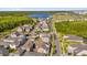 Beautiful aerial perspective of the neighborhood with views of the lake, community, and well-maintained streets at 8338 Modiano St, Orlando, FL 32827