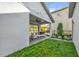 Well-maintained backyard with a covered patio, lush green space, and privacy fencing at 8338 Modiano St, Orlando, FL 32827