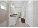Spacious bathroom with a double sink vanity, lots of lighting and walk-in shower at 8338 Modiano St, Orlando, FL 32827