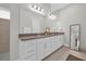 Bright bathroom with double sinks, ample counter space, and sleek modern fixtures at 8338 Modiano St, Orlando, FL 32827