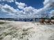 Scenic beach area with lounge chairs overlooking the inflatable water park at 8338 Modiano St, Orlando, FL 32827