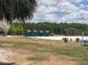 Picturesque view of the sandy beach area with covered picnic areas at 8338 Modiano St, Orlando, FL 32827