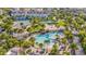 Resort-style community pool and amenities with lush tropical landscaping offer a luxurious outdoor experience at 8338 Modiano St, Orlando, FL 32827