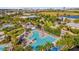 Aerial view showcasing the community pool with cabanas and various seating areas, perfect for relaxation and socializing at 8338 Modiano St, Orlando, FL 32827