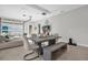 Bright dining area with contemporary furnishings, a stylish light fixture, and seamless access to the living space at 8338 Modiano St, Orlando, FL 32827