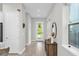 Bright entryway with hardwood floors, elegant decor, and a clear view to the front door at 8338 Modiano St, Orlando, FL 32827