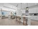 Open-concept kitchen with modern appliances, a large island, and seamless access to the living area at 8338 Modiano St, Orlando, FL 32827