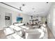 Spacious open-concept living area with modern furnishings and abundant natural light at 8338 Modiano St, Orlando, FL 32827