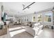 Open-concept living area with kitchen, dining, and living spaces flooded with natural light at 8338 Modiano St, Orlando, FL 32827