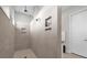 Bright shower with built-in shower niches and tile surround at 8338 Modiano St, Orlando, FL 32827